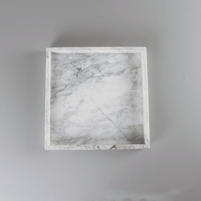 Square marble tray on a gray background
