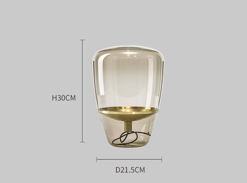 modern scandinavian bedside lamp with glass shade in neutral interior