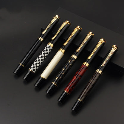 minimalist metal fountain pen on modern desk with notebook