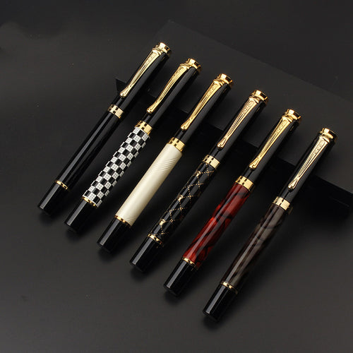 minimalist metal fountain pen on modern desk with notebook