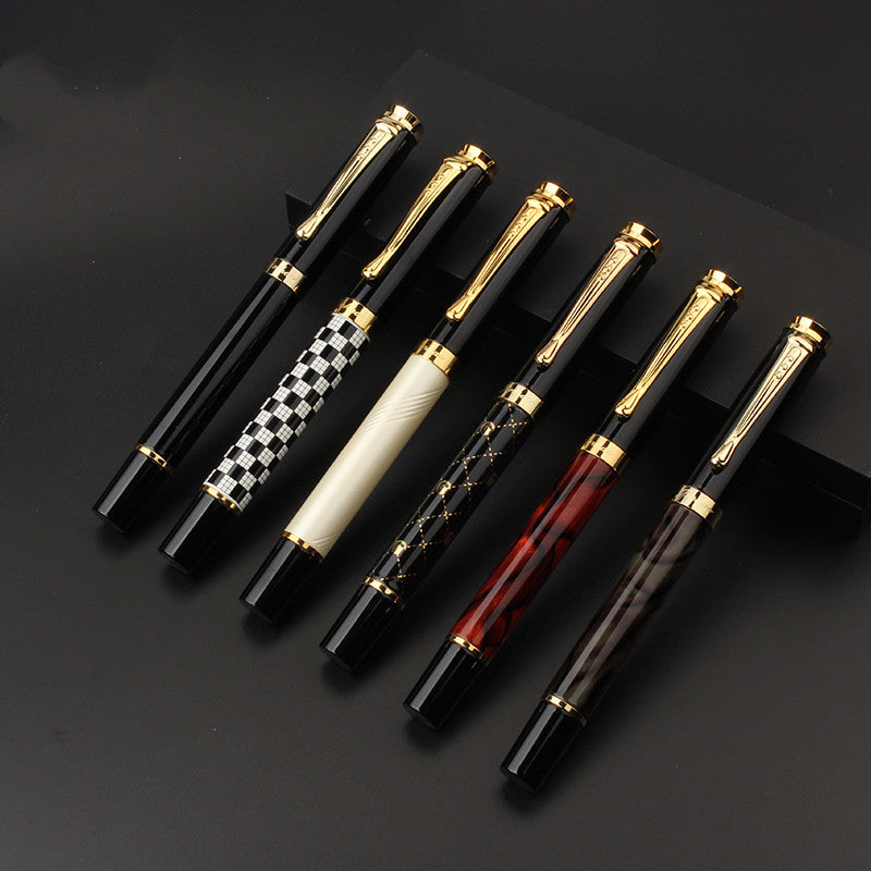 metal fountain pen used for journaling on clean workspace