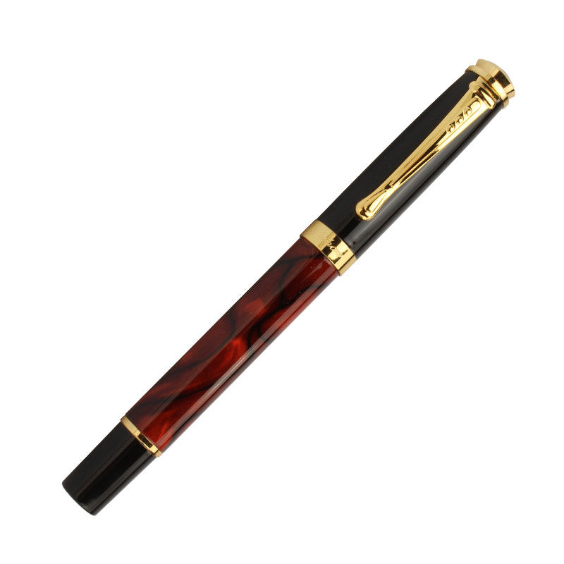 modern fountain pen on desk with notebook and tray