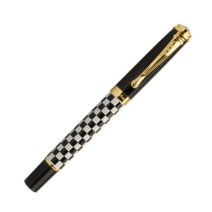 fountain pen placed on desk with organized stationery items