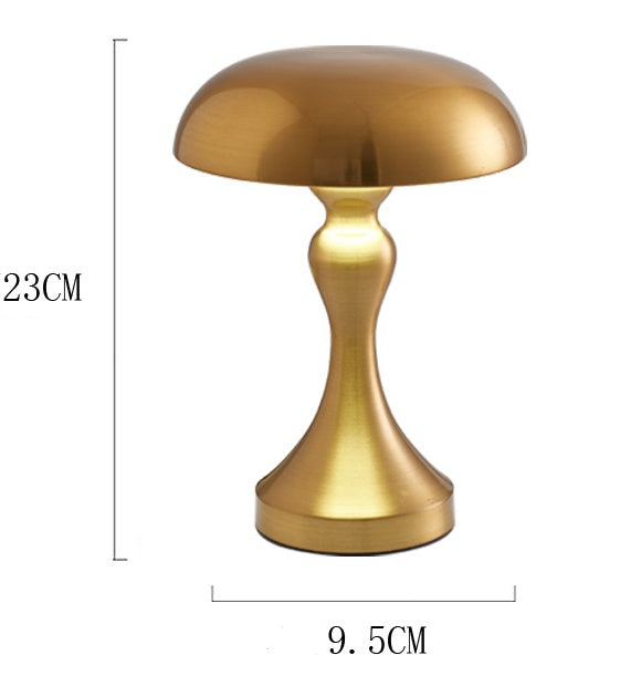 cordless sculptural lamp on console table with soft glow lighting