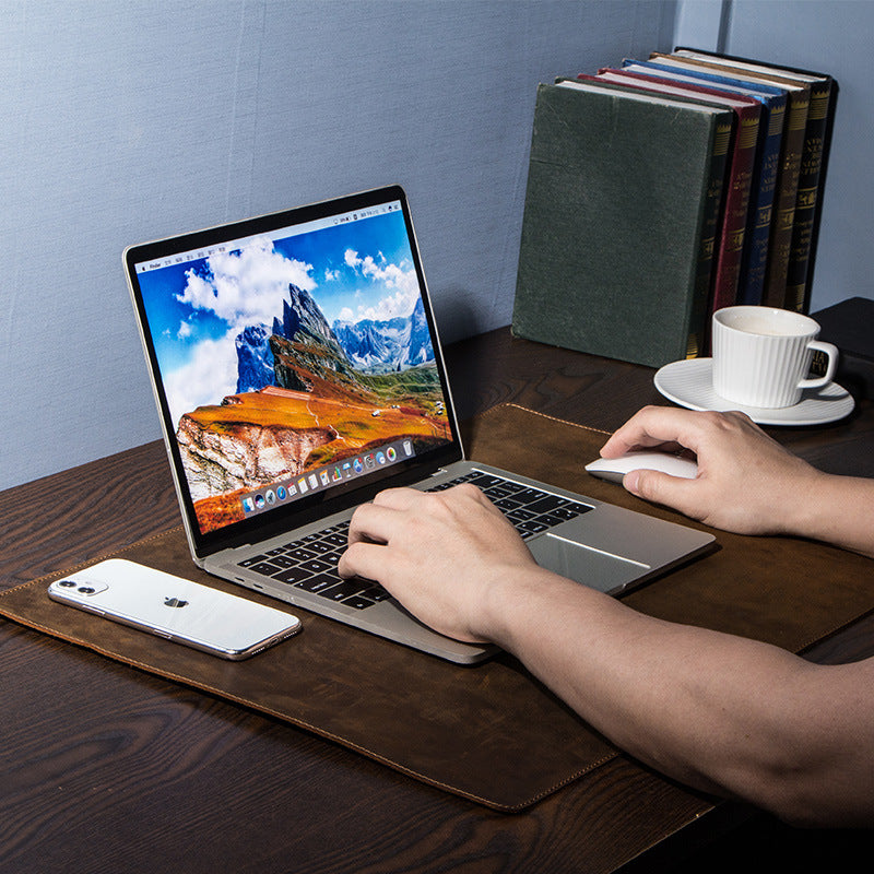 retro desk pad with laptop and notebook on wooden desk