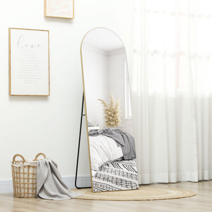 floor standing arched mirror gold frame interior design