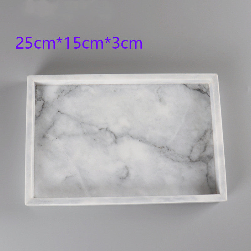 Marble-patterned tray with dimensions 25cm x 15cm x 3cm on a gray background
