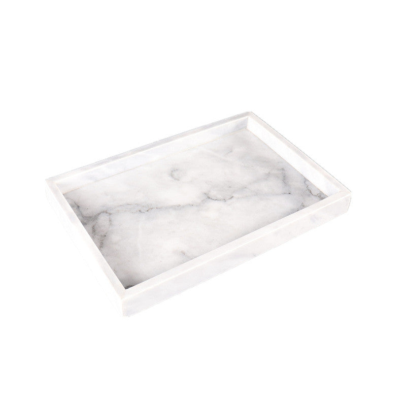 minimalist tray on vanity with fragrance and jewelry display