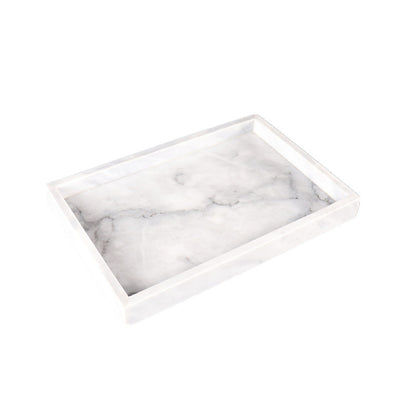 minimalist tray on vanity with fragrance and jewelry display