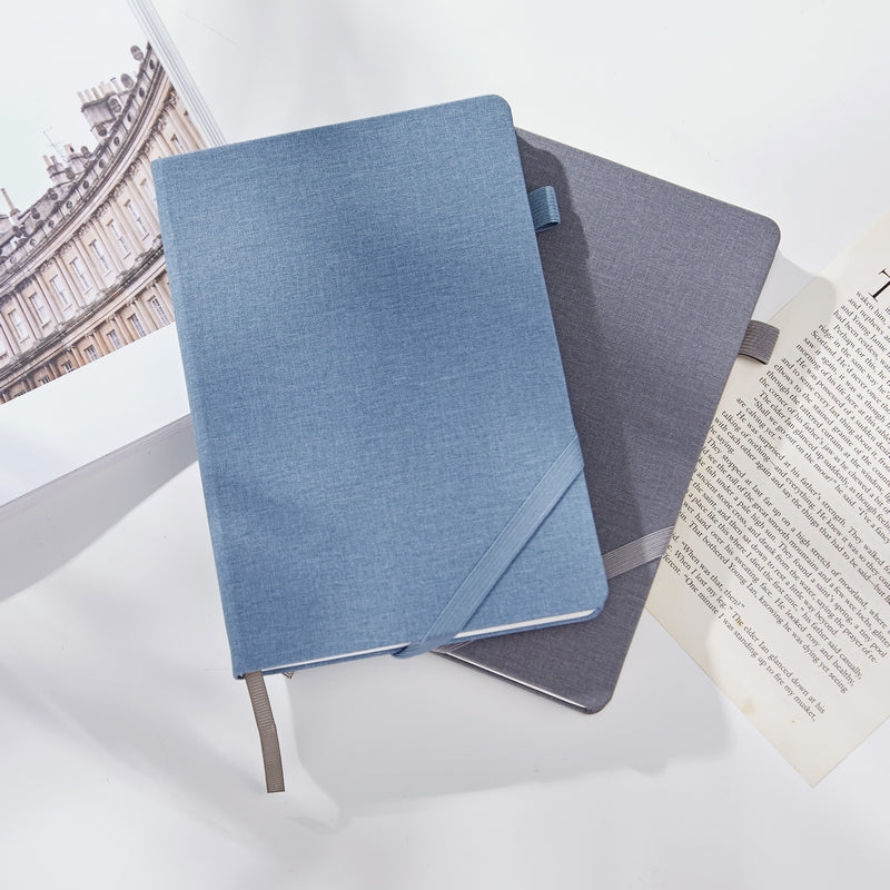 neutral stationery notebook set on organized desk