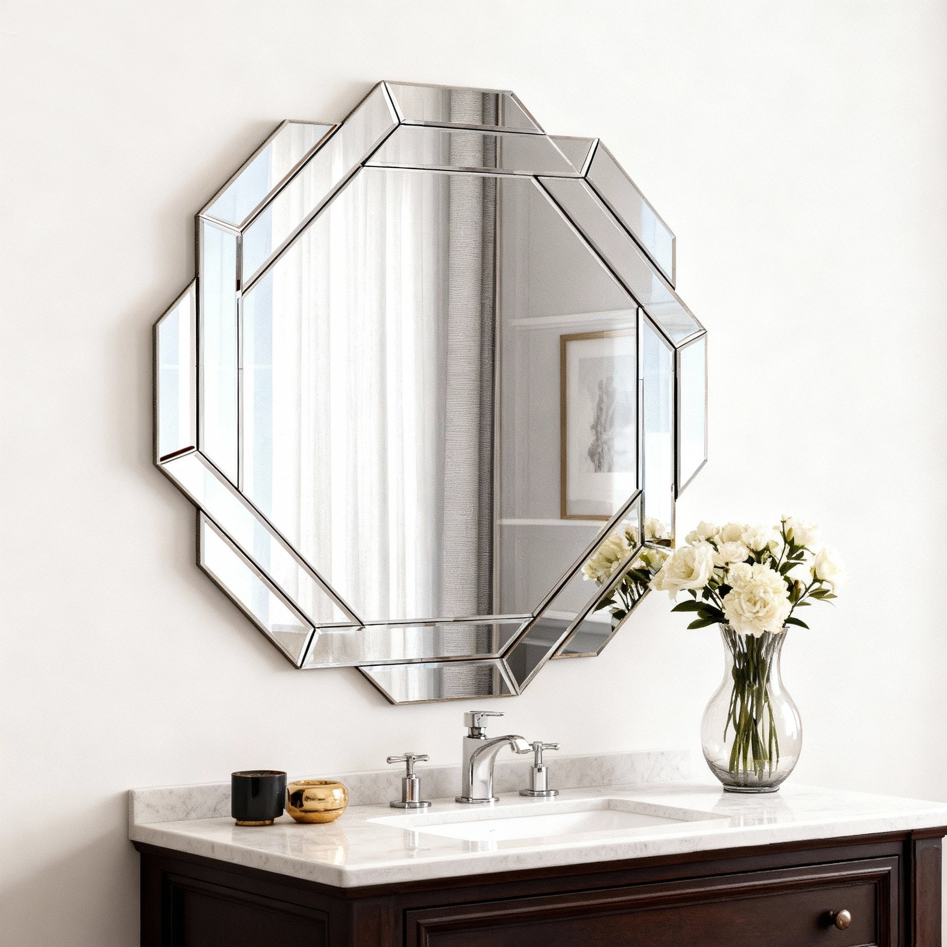 Bathroom vanity with hexagonal mirror and floral arrangement