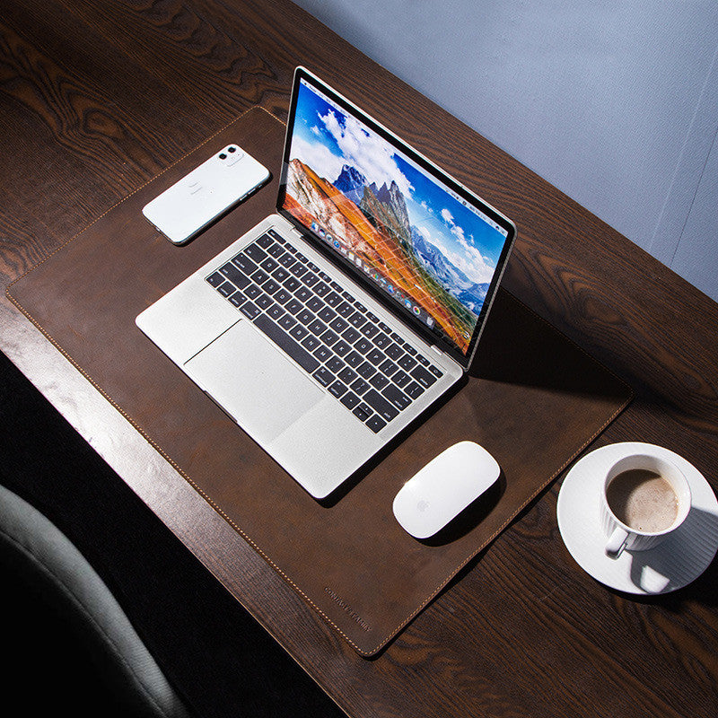 coffee leather style desk pad on modern workspace with laptop