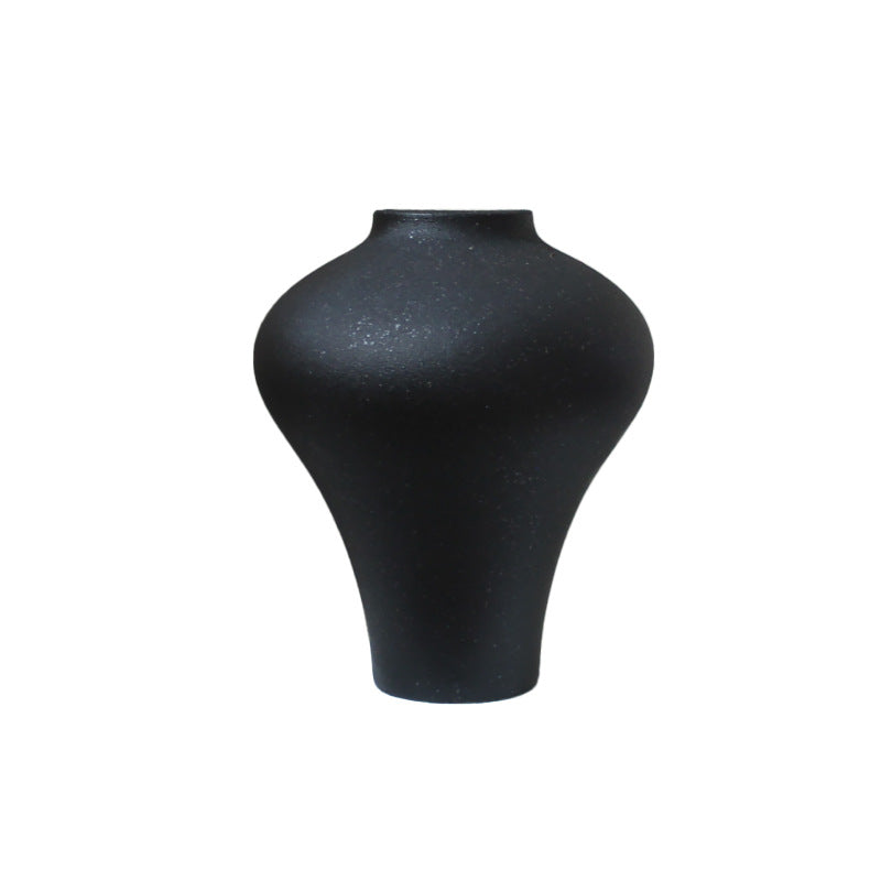Sculptural black ceramic accent 