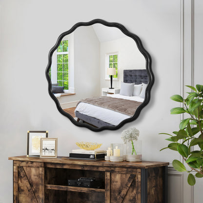 black wavy mirror styled in contemporary bedroom decor